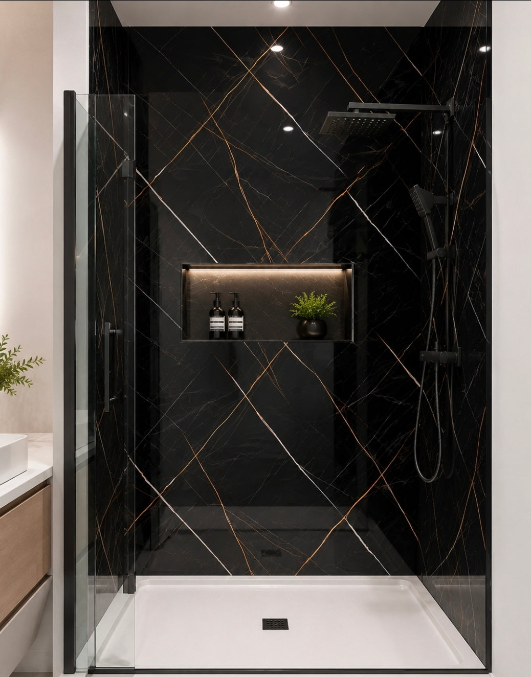 Black & Gold PVC Marble Sheet installed as a luxury shower wall panel, waterproof high gloss wall panel for modern bathrooms.