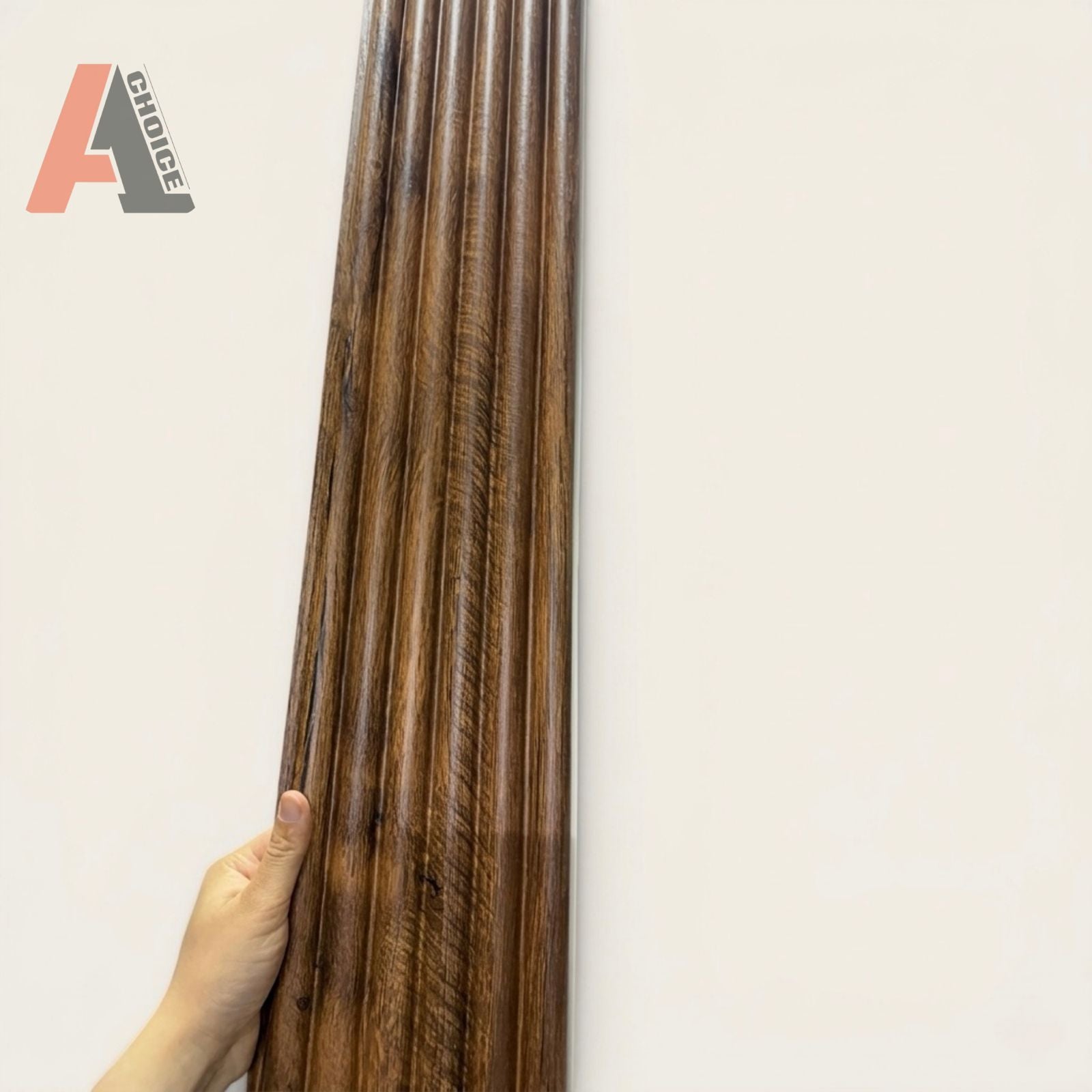 WPC Slat wall panel Tambour Style  held by a hand against a white background with 'A1 Choice' logo.